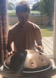 Aaron playing the Handpan
